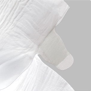Close-up of adjustable reusable magic tape tabs for disposable baby diaper
