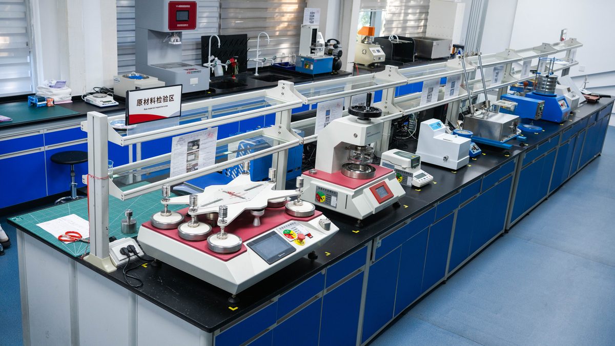 Feminine care raw material QC lab — ISO 17190-6 absorbency testing
